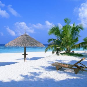 Boundless sea and relaxing white beach